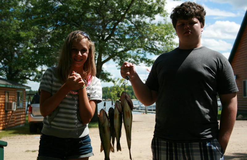 Kids fishing at Cozy Bay Resort.
