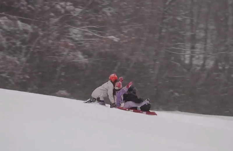 Sledding at Mountain Springs Lake Resort.