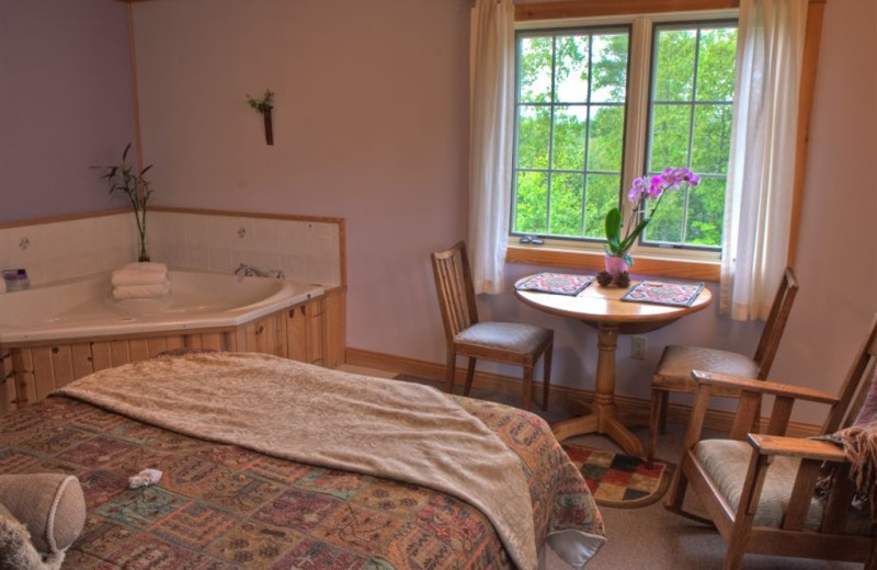 Cabin bedroom at Poplar Creek B & B.