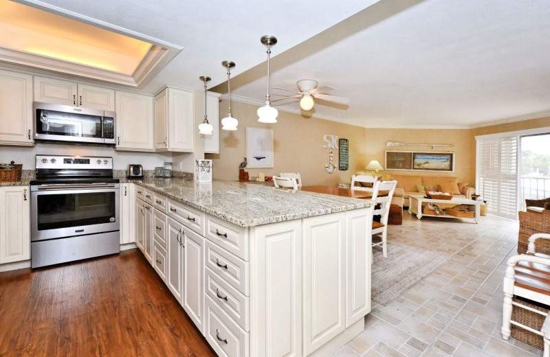 Rental kitchen and living room at El Presidente Condos.