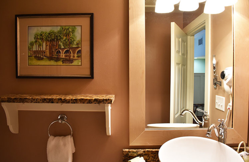 Bathrooms at the Inlet Sports Lodge featuring luxurious details such as granite countertops, sink bowls and showers with massaging body jets. 