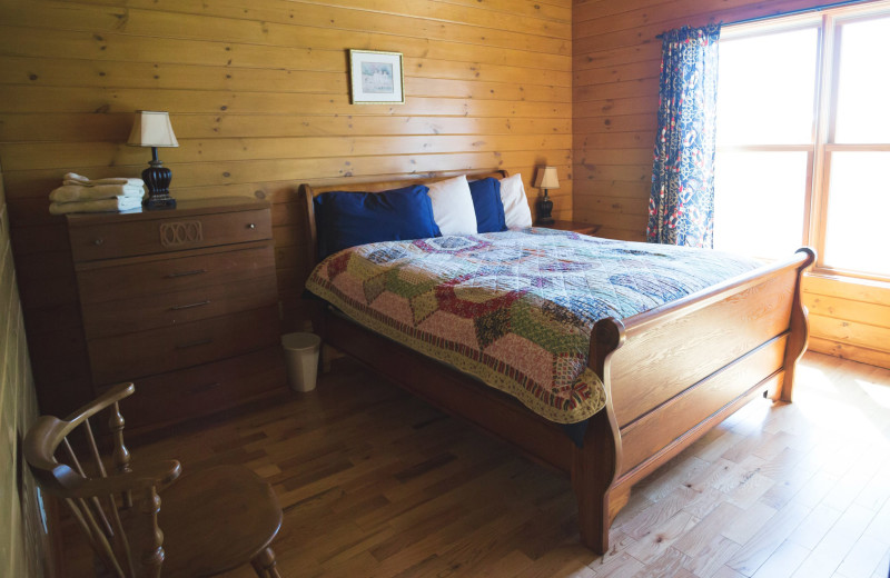 Cabin bedroom at Cobtree Vacation Rental Homes.