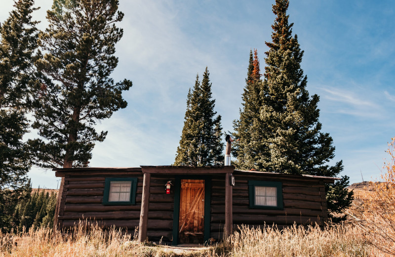 Cabin 10 exterior at Trappers Lake Lodge & Resort. This historical cabin houses for full size beds in one large room