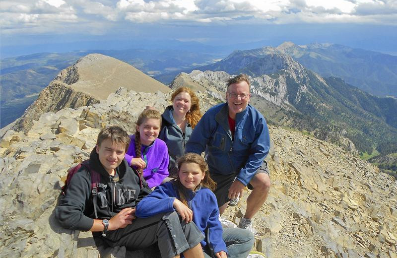 Family in mountains at Bridger Vista Lodge.