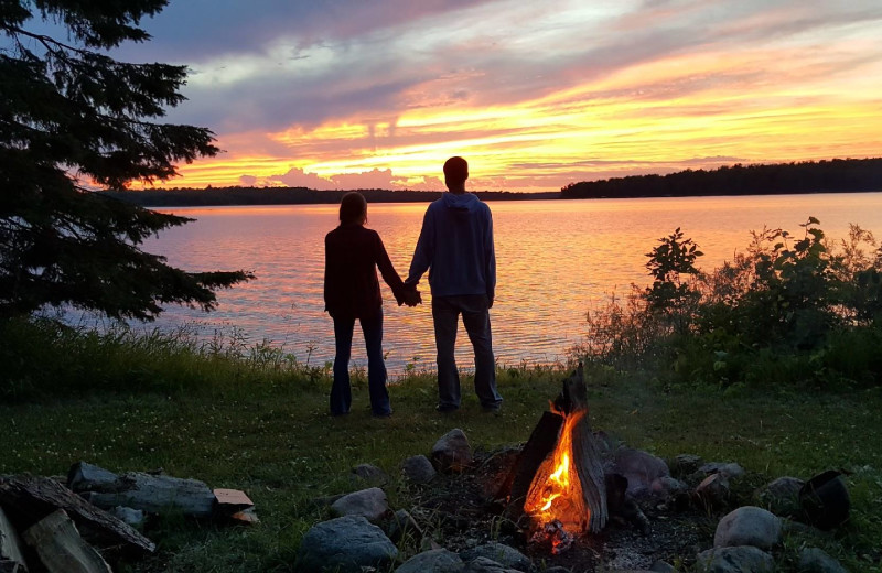 Couple holding hands at YMCA Camp Du Nord.