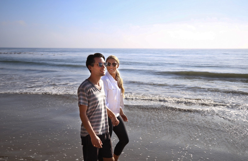 Couple on beach at Dolphin Bay Resort & Spa.