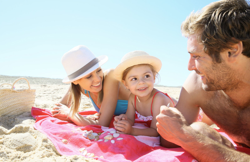 Family on beach at Bay View Resort.