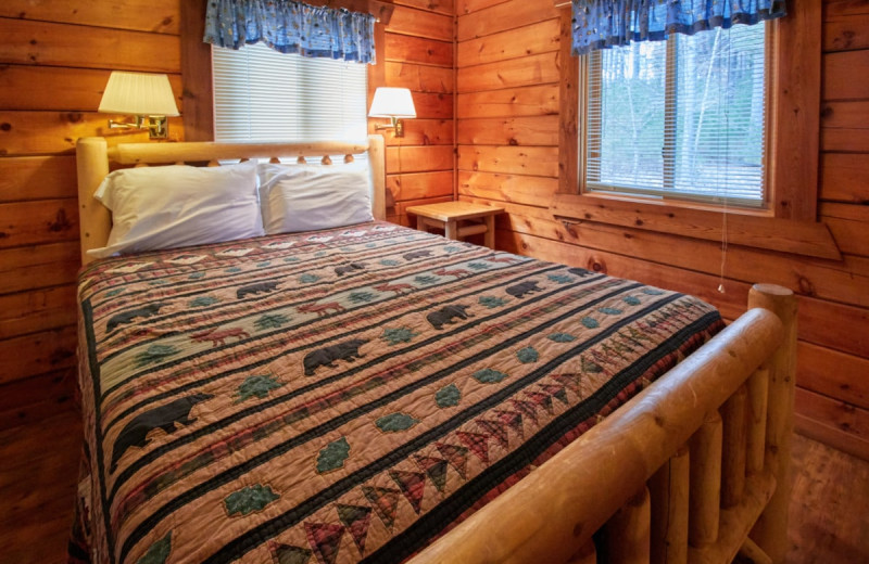 Cabin bedroom at Yogi Bear's Jellystone Park Warrens.