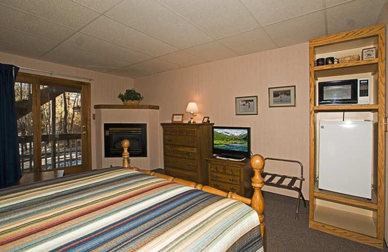 Guest room with fireplace at 4 Seasons Inn.