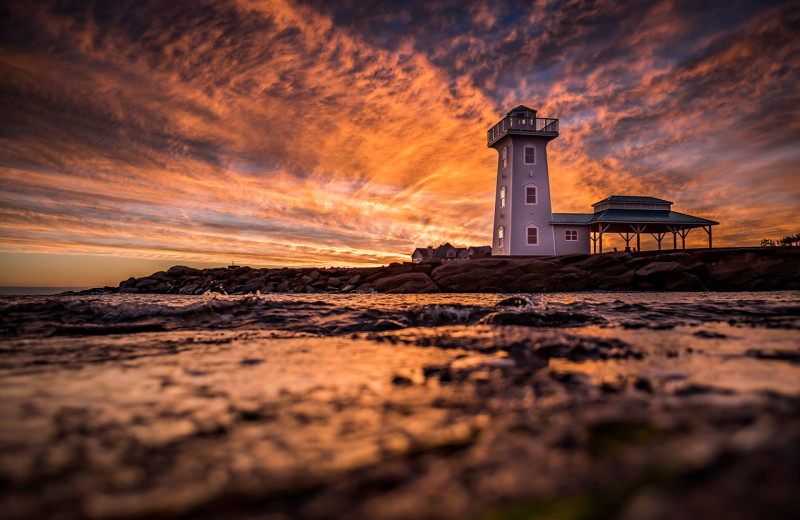 Lighthouse sunset at Fox Harb'r Resort.