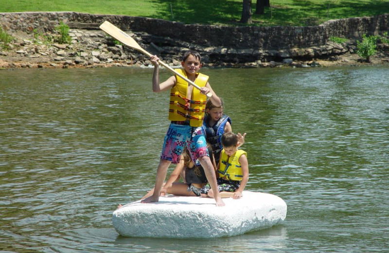 Kids playing in the lake at Paradise Cove Marine Resort.