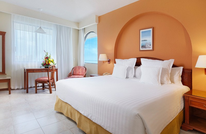 Guest room at Tucancun Beach Resort and Villas.