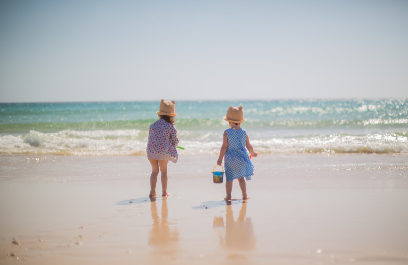 Kids on beach at Topsail Realty.