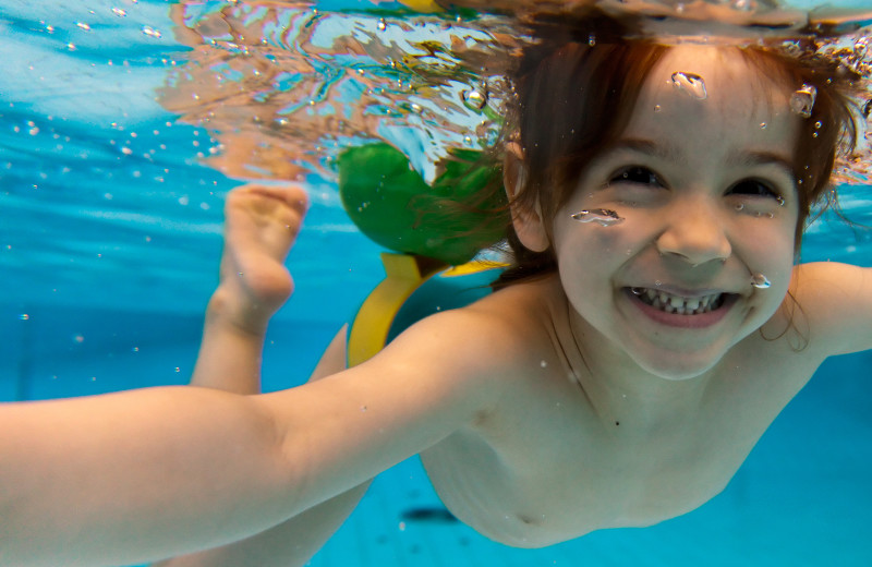 Kid swimming at Maui Sands Resort & Indoor Waterpark.