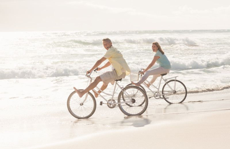 Biking on beach at Exclusive Properties - Isle of Palms.