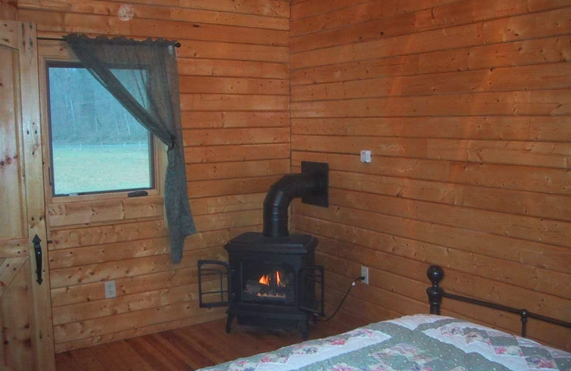 Cabin bedroom at Gander Island River Log Cabins.