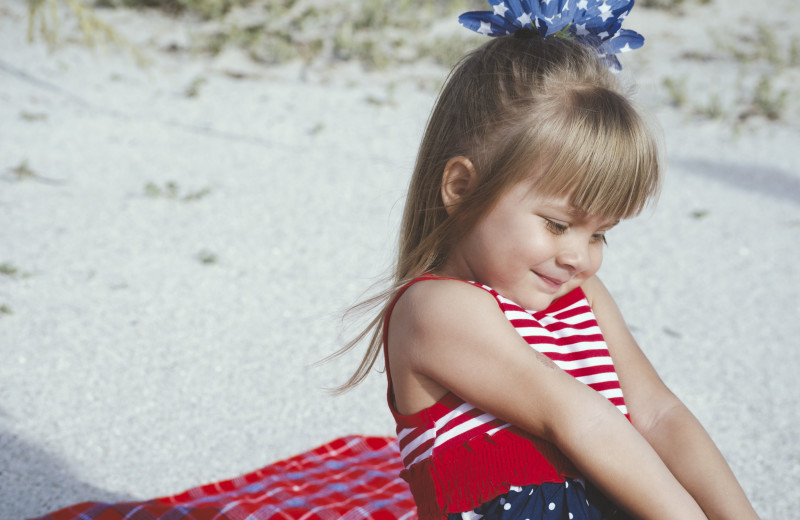 Kid on beach at Access Realty Group.