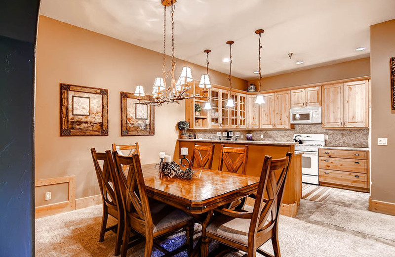 Rental kitchen and dining area at Summit Vacations.