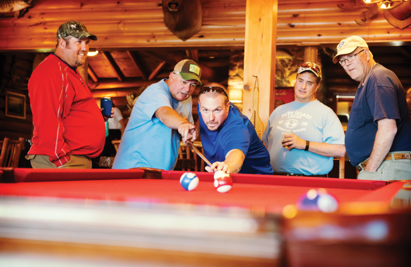 Group playing billiards at Tetu Island Lodge.