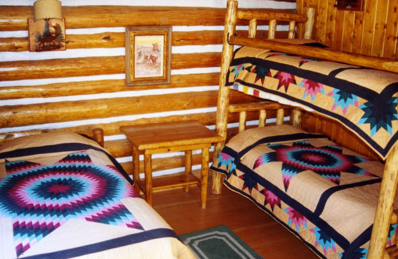 Traditional Log Beds at Nine Quarter Circle Ranch