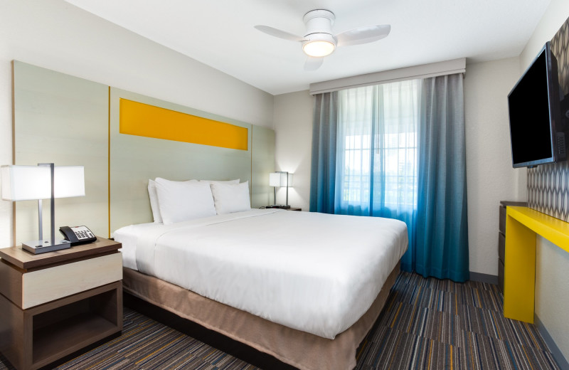 Guest bedroom at Holiday Inn Resort Orlando Suites - Waterpark.