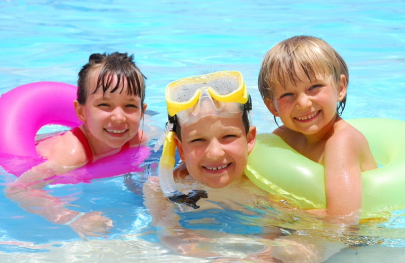 Swimming in the pool at Casiola Vacation Homes.