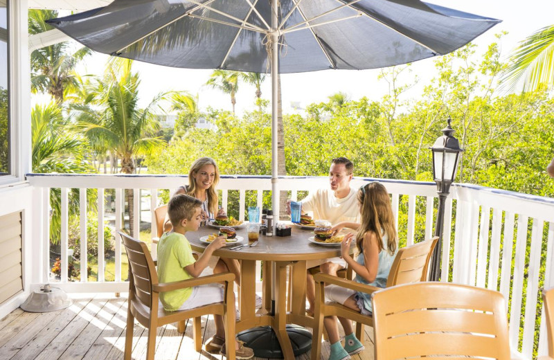 Family on balcony at Palm Island Resort.