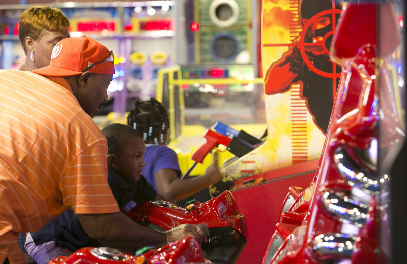 Family playing at arcade at Massanutten Resort.