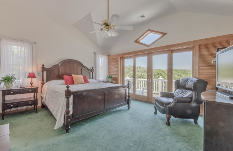 Rental bedroom at Joe Lamb Jr. & Associates Vacation Rentals.