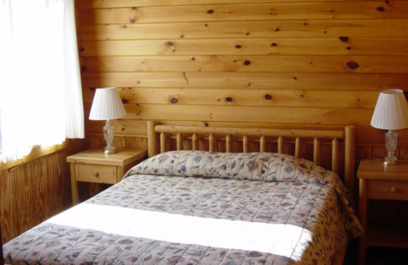 Rustic Cottage bedroom at Ampersand Bay Resort.