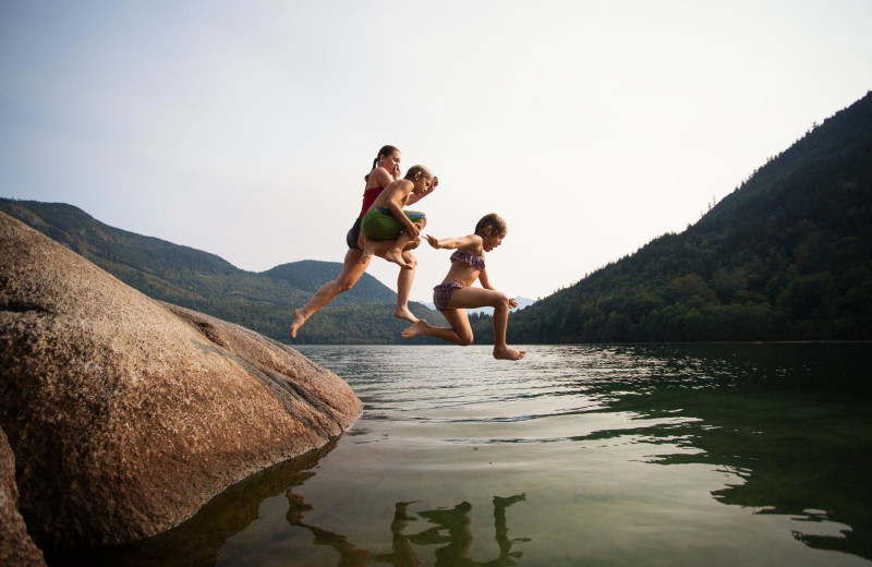 Kids jumping in lake at Harrison Beach Hotel.