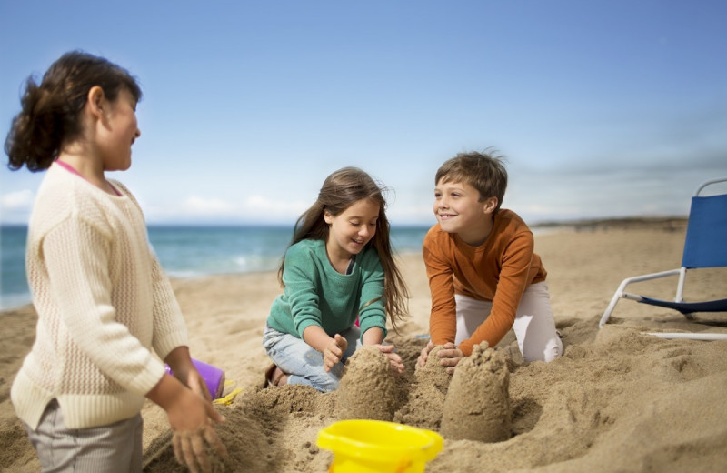 Family on beach at Monterey Tides.