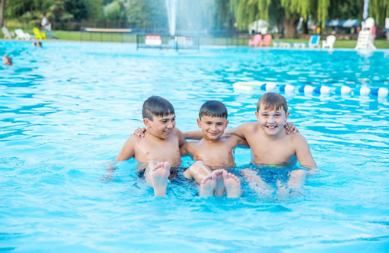 Kids in pool at Great Blue Resorts- Vine Ridge Resort.