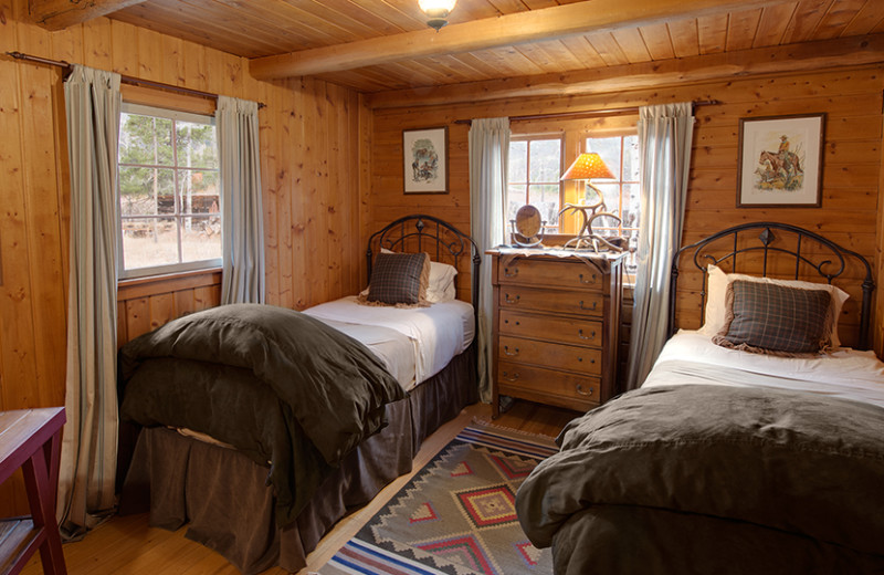 Cabin bedroom at Rawah Ranch.