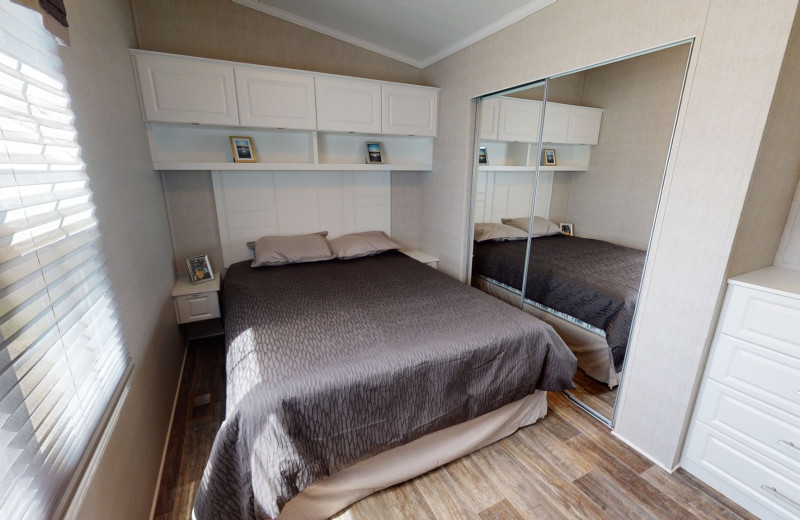 Cottage bedroom at Great Blue Resorts- Shamrock Bay Resort.