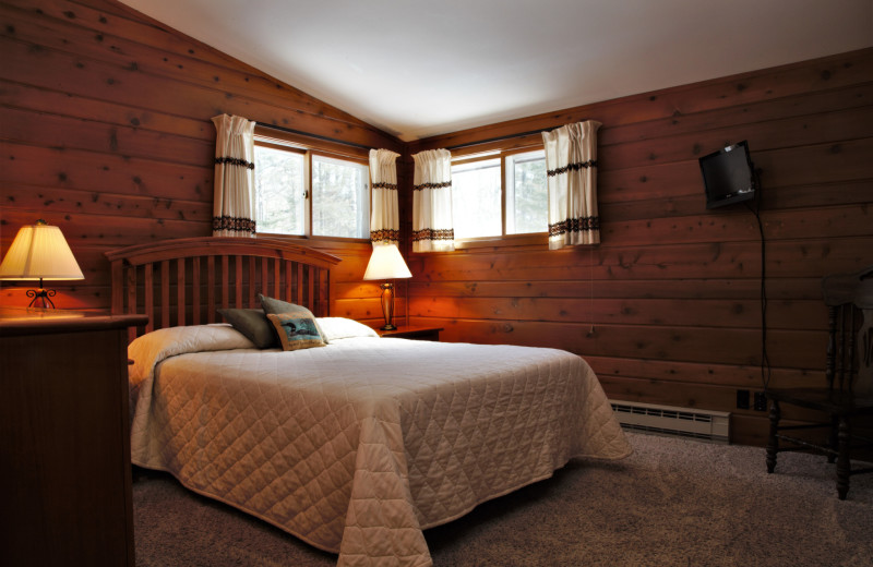 Cabin bedroom at Northwoods Vacation Rentals.