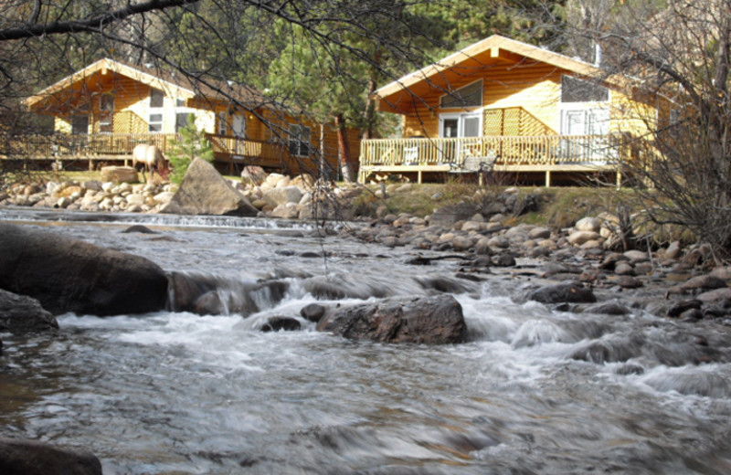 Cabins by the river at Riverview Pines.