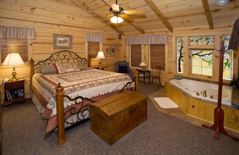 Rental bedroom with whirlpool at Dogwood Cabins LLC.