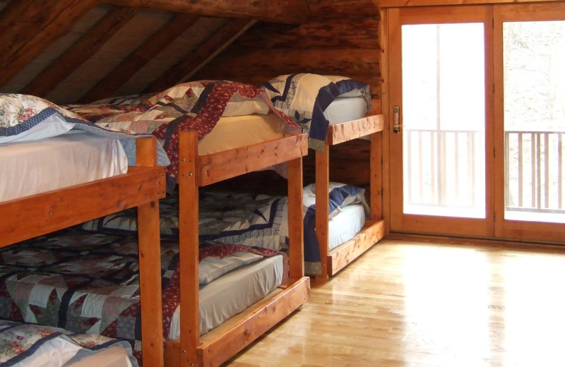 Cabin bedroom at Creeks Crossing Cabins.