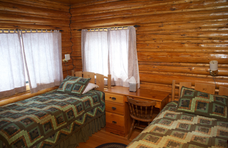 Cabin bedroom at Triangle X Ranch.