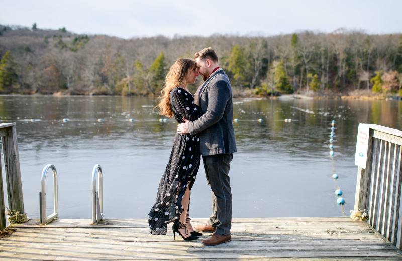 Couple by lake at Arrow Park Lake and Lodge.