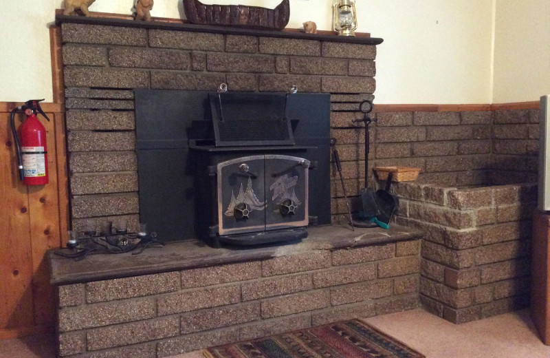 Cabin fireplace at Bear Paw Lodge.