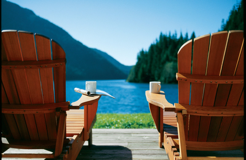 Lounge chairs by lake at Clayoquot Wilderness Resort.