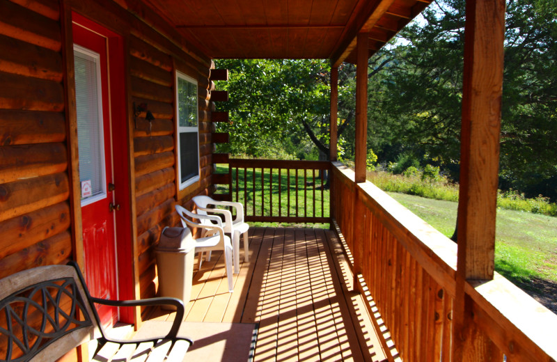 Relax on your cabin porch at Ozark Cabins.