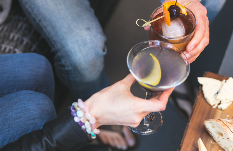 Couple sharing drink at Shorepine Vacation Rentals.