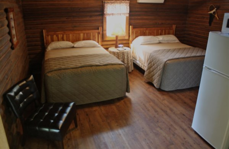 Cabin bedroom at Lindsey's Rainbow Resort.