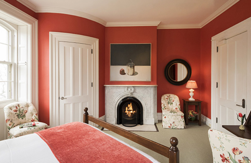 Guest room with fireplace at The Inns of Aurora.