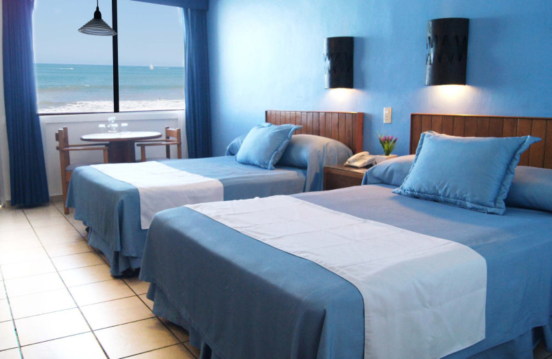 Guest room at Costa de Oro Beach Hotel.