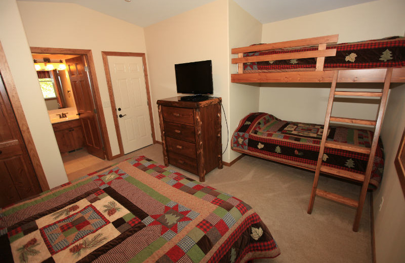 Guest room with bunk beds at East Silent Lake Vacation Homes.