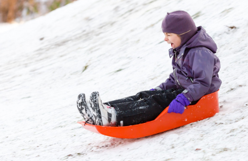 Sledding at Aspen Square Condominium Hotel.